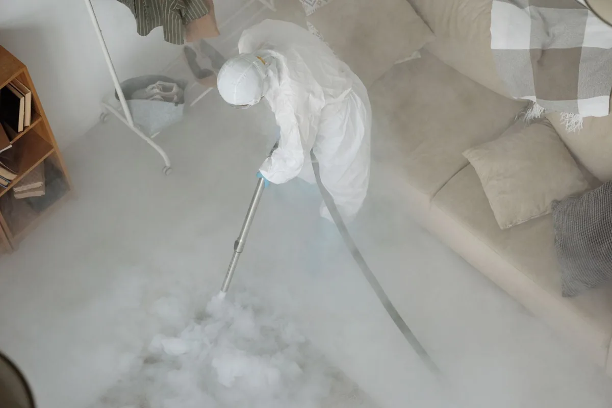Biohazard cleanup technician in protective equipment, Perry, GA